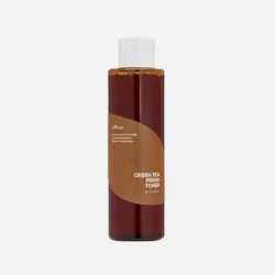 Bottle of Green Tea Fresh Toner with natural ingredients background